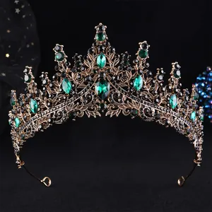 Detail of vintage bronze bridal tiara with emerald crystals and black rhinestones
