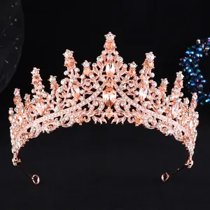 Detailed view of rose gold bridal crown with champagne crystals and pear-cut rhinestones