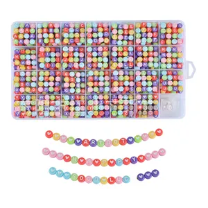 Detail showing colorful alphabet beads in plastic organizer for DIY jewelry making kits