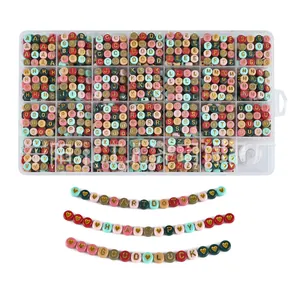 DIY alphabet bead set in 24-grid box with pastel colors and golden letter engraving