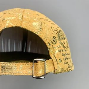 Detailed view of yellow baseball cap back with adjustable silver metal buckle and gold foil prints