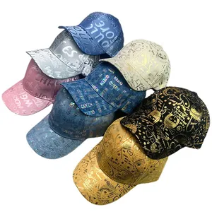 Stack of shiny metallic and reflective hip-hop baseball caps in multiple colors