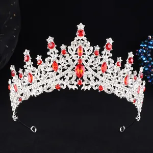 Close-up of European style silver bridal crown with red water-drop gems and sparkling rhinestones