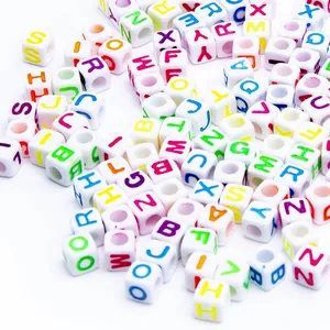 Macro shot of colorful A-Z square alphabet beads for DIY jewelry and necklaces