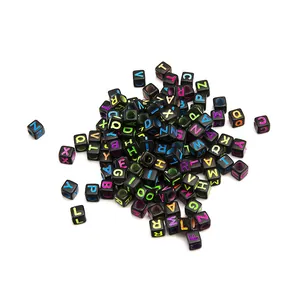 Macro shot of 6mm black square acrylic alphabet beads with colorful A-Z engraved letters
