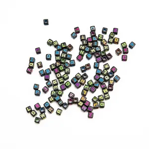 Macro detail of black square alphabet beads with colorful A-Z letters for DIY crafts