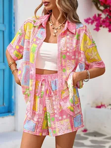 Close-up of printed summer set featuring tropical patterns on shirt and drawstring shorts