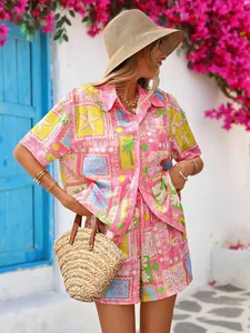 Detail of bright pink tropical print shirt and shorts set with vibrant ocean patterns