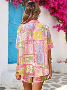 Detail of pink tropical print shirt and shorts set with beach elements and shell patterns