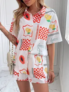 Detail of summer two-piece set featuring lemon and geometric patterns on white fabric