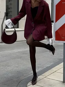 Maroon striped blazer with ruffled cuffs, matching crescent bag and bow pointed shoes