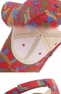 Macro detail of camouflage baseball cap featuring a reinforced brim and structured crown