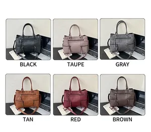 Six colors of vintage leather handbags with multiple pockets on an office desk setting