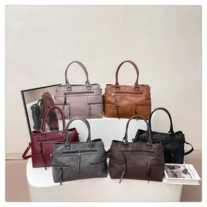 Detail view of large capacity handbags with multiple front zippers in six assorted colors