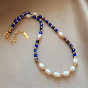 Lapis lazuli and freshwater pearl necklace with golden beads and extension chain