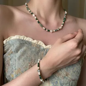 Freshwater pearl and green aventurine necklace with bracelet set on a model