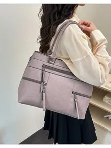 Large lavender PU leather tote bag with functional zippers shown on a model