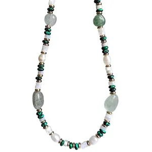 Green aventurine and freshwater pearl beaded necklace with gold spacers on white background