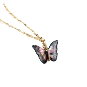 Titanium steel butterfly necklace with purple iridescent wings and sparkling crystals