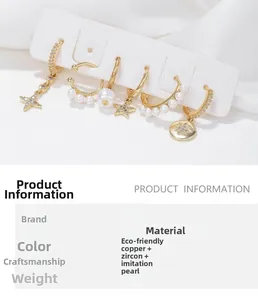 Detail showing gold plated hoop earrings set with pearls, star charms and cubic zirconia