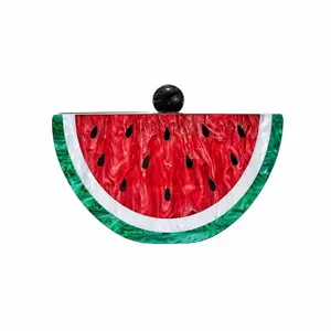 Macro shot of watermelon acrylic evening clutch showing green rind and black seeds details