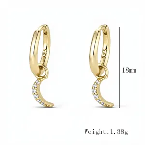 Detail of S925 sterling silver moon earrings with pavé cubic zirconia measuring 18mm