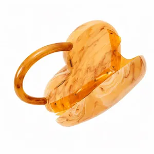 Retro heart-shaped acrylic evening bag with amber marble pattern and top handle design