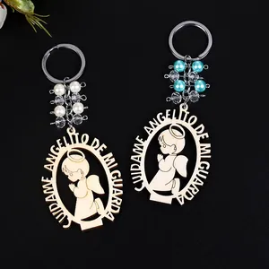 Detailed macro view of laser-cut wooden angel keychains with Spanish prayer and blue beads