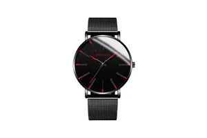 Detail of MONYORN black quartz watch with red hour markers and Milanese mesh strap
