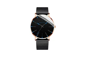 Detail of rose gold quartz watch with black mesh strap and blue index markers