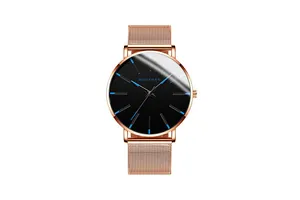 Detail of rose gold Milanese mesh strap and black watch face with blue hands