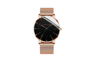 Close-up of MONYORN watch with rose gold mesh band and black dial highlights