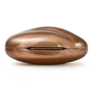 Detail of a marble-textured bronze acrylic clutch bag with a sleek polished hard shell