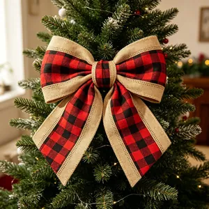 Red and black buffalo plaid Christmas bow with burlap trim on a green festive tree