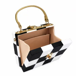 Retro black and white checkered box bag with gold handle and satin lining