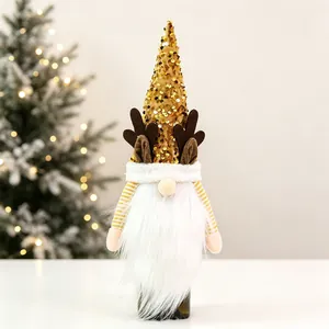Close-up of Christmas gnome wine bottle cover with gold sequins and reindeer antlers