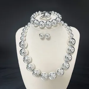 Polished silver bead jewelry set including necklace, bracelet, earrings and ring on stand