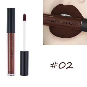Detail of matte dark brown liquid lipstick with applicator and lip swatch effect