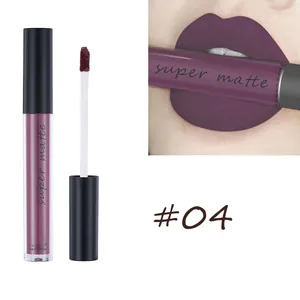 Macro shot of matte lip glaze #04 in dark berry purple on lips with velvet texture tube