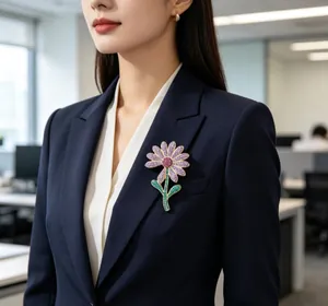 Detailed close-up of a luxury purple crystal daisy brooch pinned on a dark navy business suit