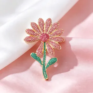 Exquisite pink daisy flower brooch with heavy crystals and golden metal leaf for suit coats
