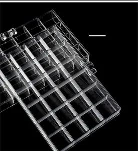Macro view of transparent acrylic storage box with 40 compartments for nail art