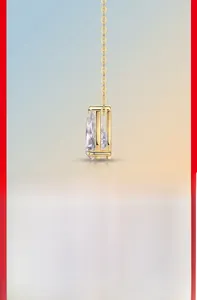 Detail shot of pear-cut moissanite pendant with golden chain and side hollow design