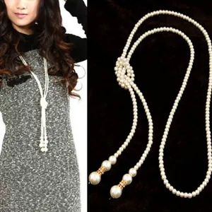 Multi-layer faux pearl sweater necklace with knotted design and gold rhinestone accents