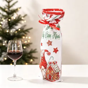 Christmas gnome wine bottle gift bag with red ribbon on a festive holiday table