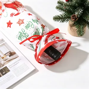 Detail of Christmas wine bottle bag with red ribbon and Candy Cane Kisses print