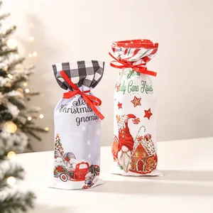 Two Christmas wine gift bags with gnome truck and candy cane kisses printed designs