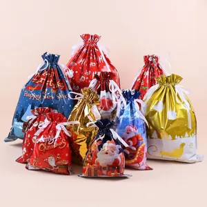 Variety of Christmas drawstring gift bags featuring festive patterns and metallic finish