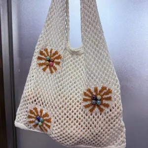 Minimalist beige knit mesh shoulder bag with vintage floral patterns and bead accents
