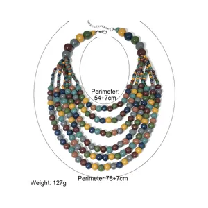 Collana boho multistrato con perle di legno in toni terra e catena di estensione